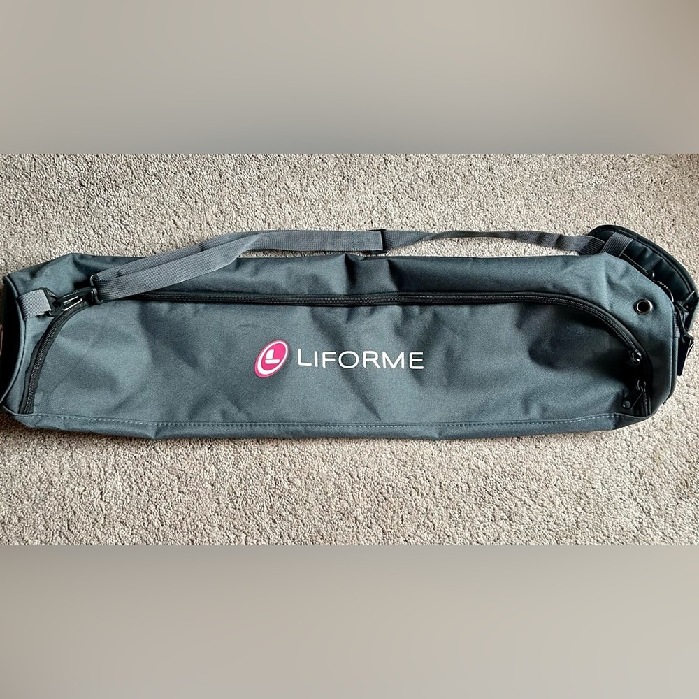 Liforme yoga bag mat carrier with adjustable straps.  Brand new with tag.  Grey